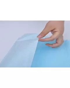 Babero desechable azul para evitar manchas en centros sanitarios y geriátricos